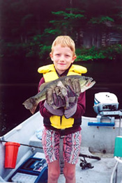 photo of boy with fish